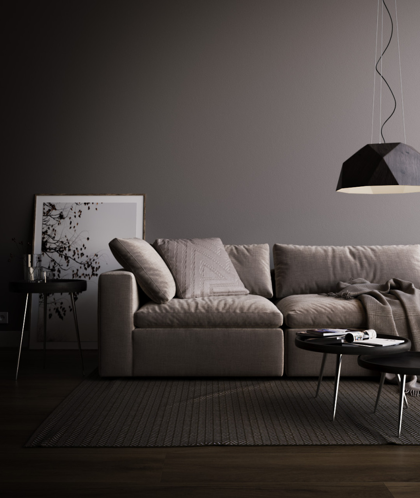 Living room couch and coffee table with low handing light.